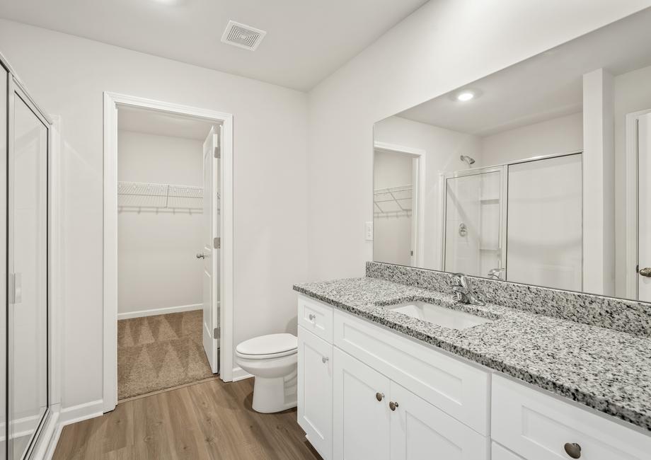 Get ready for your day in the spacious master bathroom