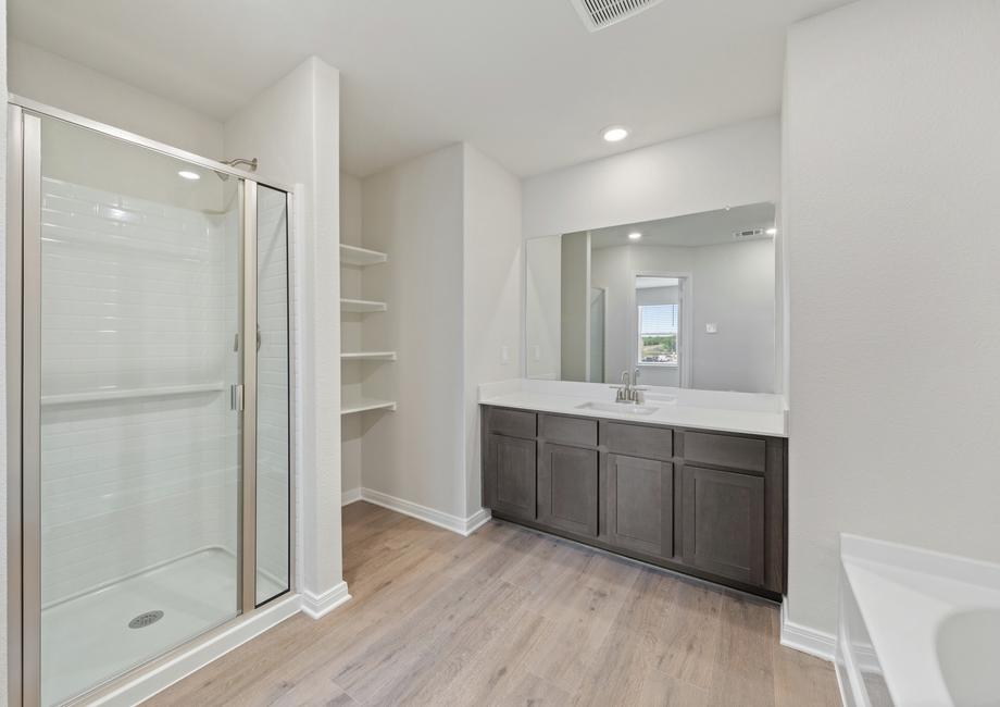 The master bathroom of the Colorado plan has a spacious vanity space and walk-in shower.