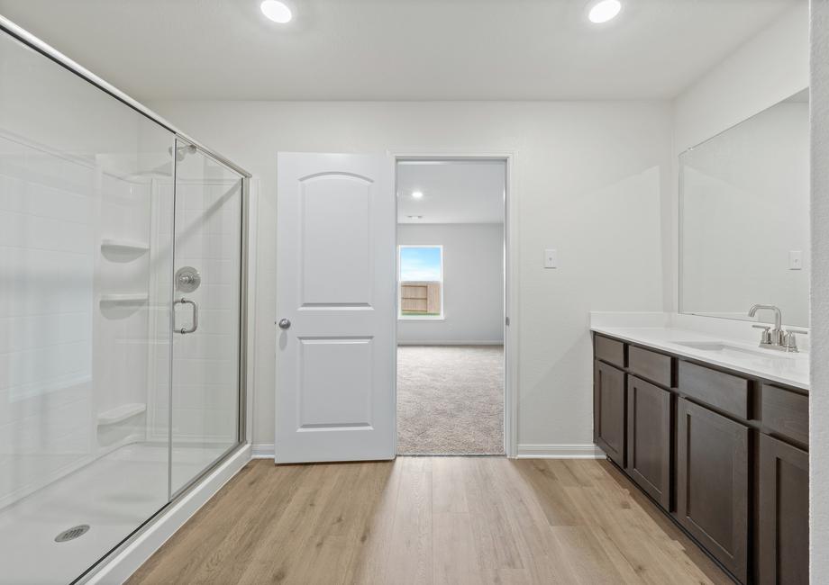 The master bathroom of the Sabine has a large, glass walk-in shower.