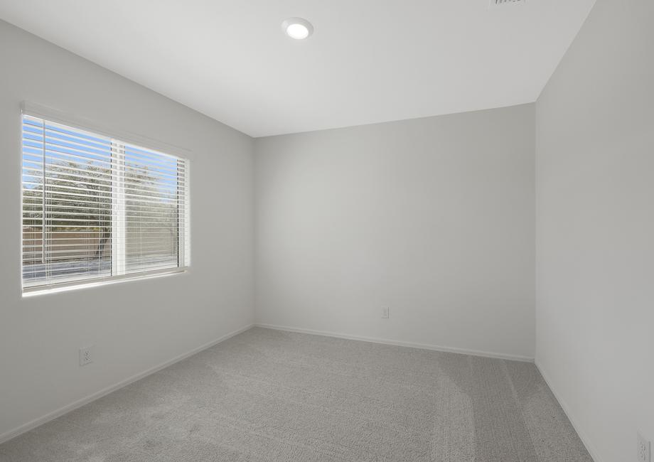 Guest bedroom with large windows and privacy.