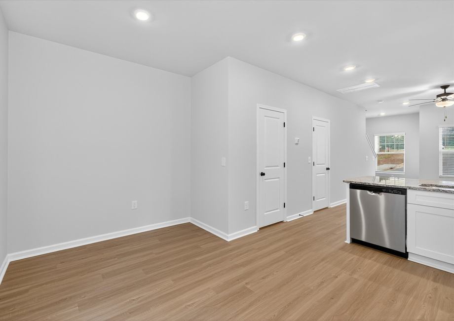 The dining room is off of the kitchen. 