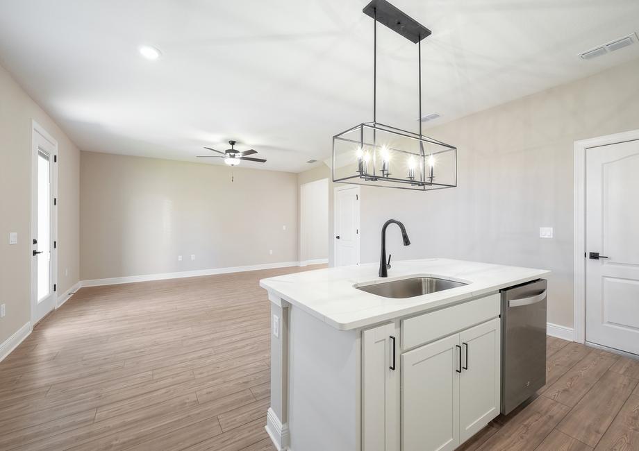 The kitchen opens up to the dining and family room creating a beautiful open concept space.