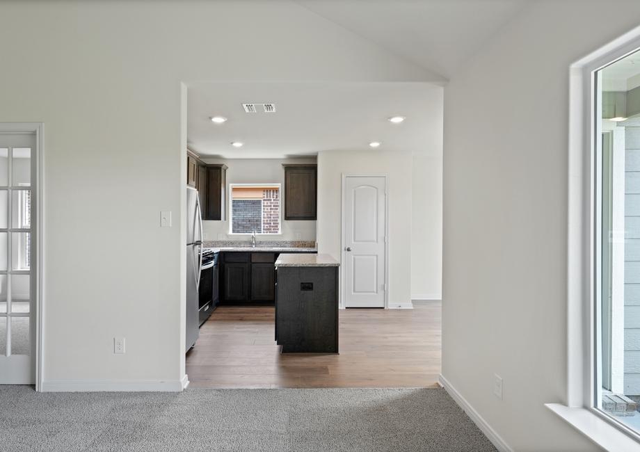 The open layout connects the family room with the kitchen and dining room.