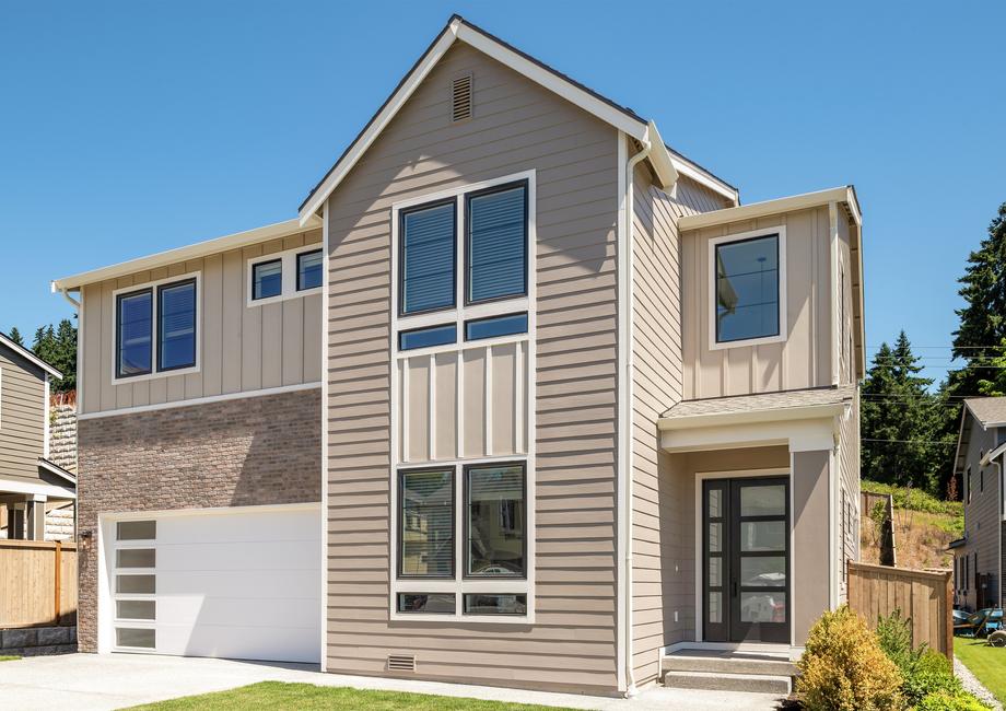 Two-story Cappuccino with brick accents and an inviting front porch.