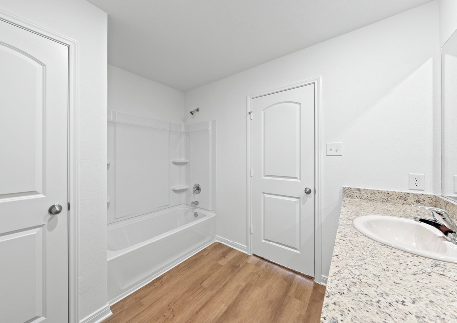 A shower/tub combination in the master bathroom