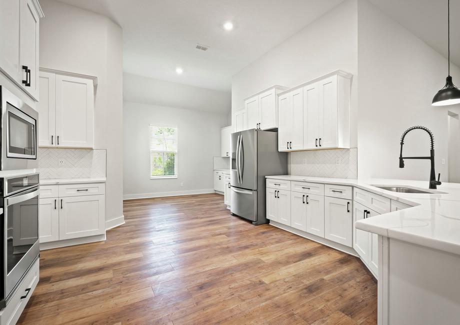 The chef ready kitchen includes stainless steel appliances.