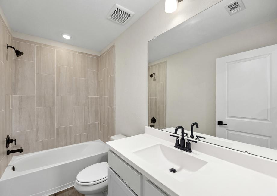 The secondary bathrooms include large vanities.