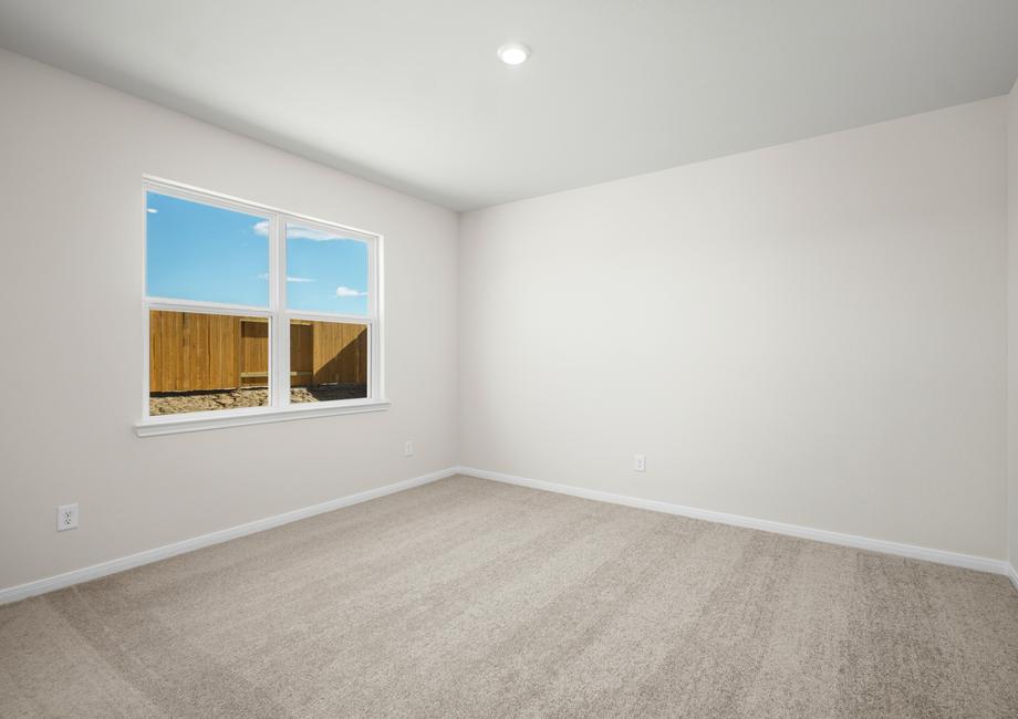 The master bedroom has a gorgeous window with plenty of natural lighting.