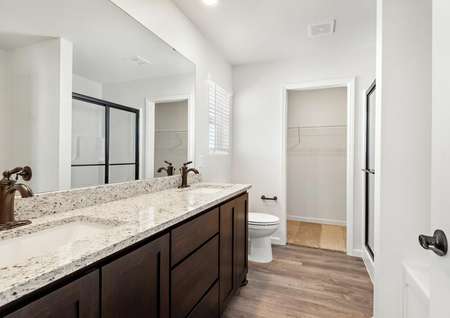 The master bathroom has a spacious vanity for you to get ready at
