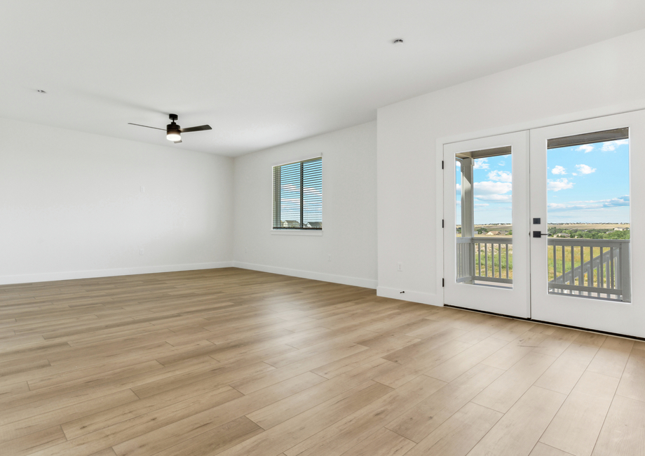 The large living room is open with lots of large windows that let in great, natural light.