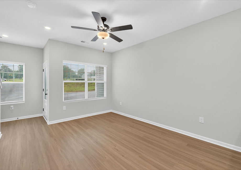 Windows let in lots of light to the living room. 