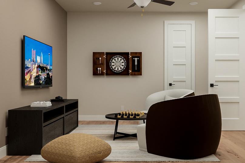 Rendering of the media room showing a
  media cabinet with tv left, a dartboard centered on the wall, and two
  matching chairs with table on the right.Â 