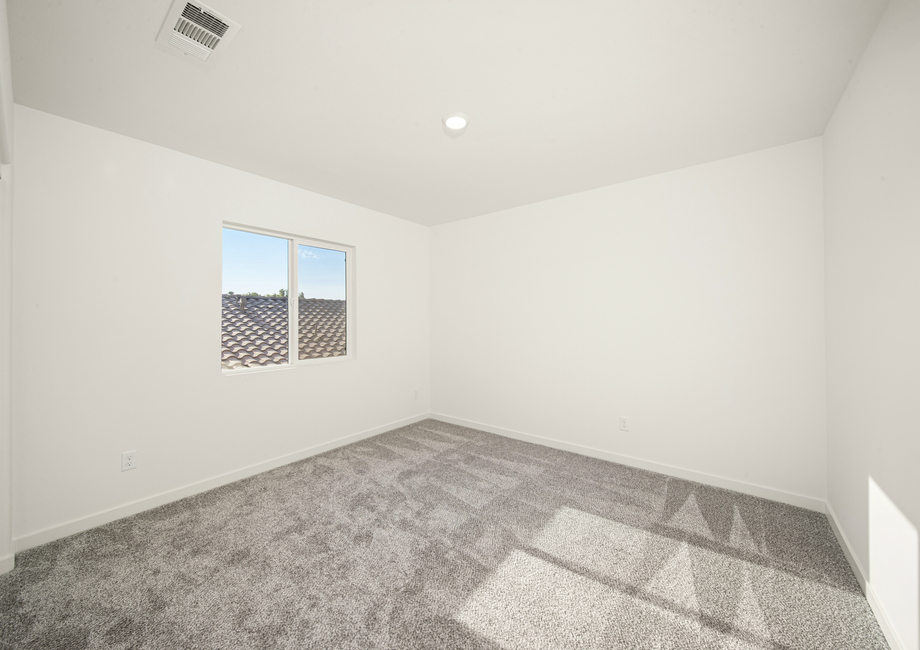 The secondary bedroom has carpet.