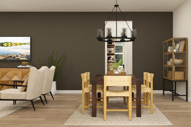Rendering of the dining room centered
  between the living room and kitchen. The space is furnished with a six-person
  table on a rug, large chandelier and a decorative cabinet.