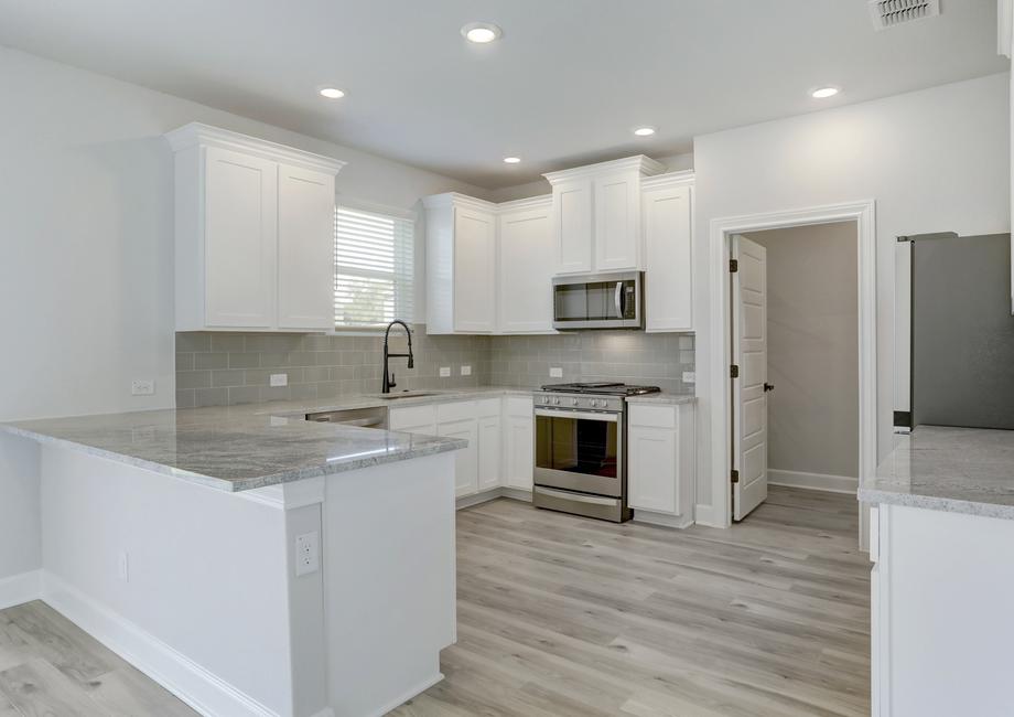 Upgraded kitchen with stainless appliances.