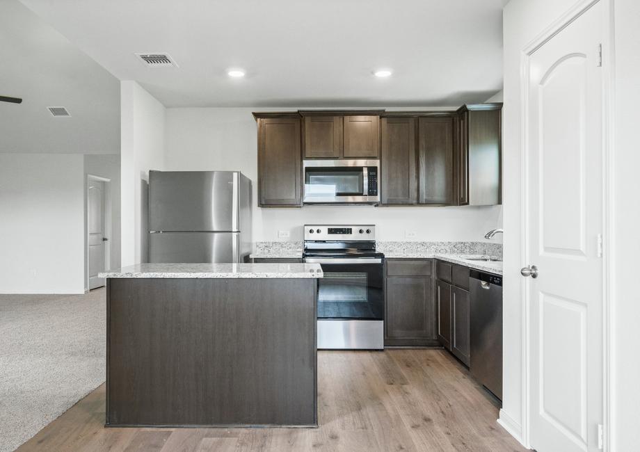 The kitchen of the Sabine has gorgeous wood cabinetry.