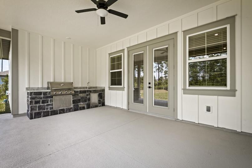 Being your cooking outdoors with the covered outdoor kitchen.