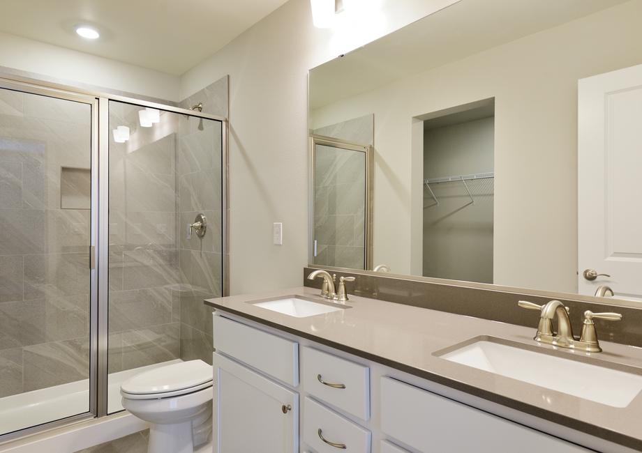 The Montana has a dual sink vanity and step in shower.