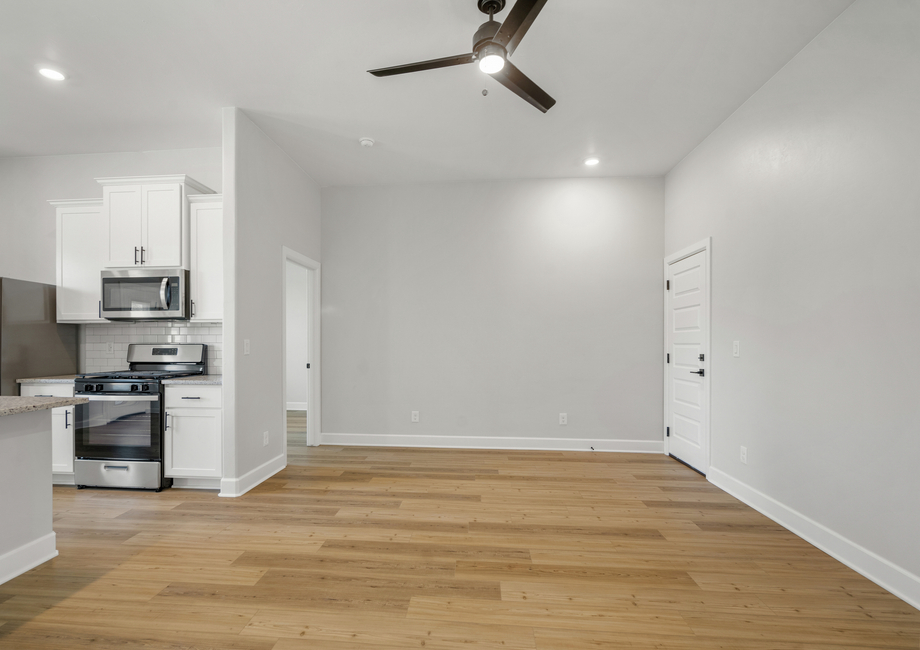 The cozy family room has enough room for furniture for everyone to have a seat.