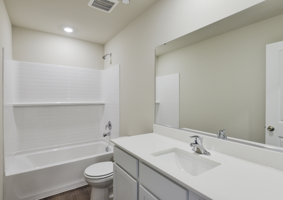 The secondary bathroom has a tub/shower combo.