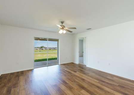 The family room is spacious with a sliding door to the back patio