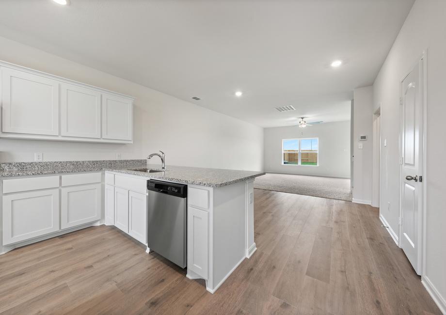 The dining room of the Driftwood sits in betweent the kitchen and the family room.