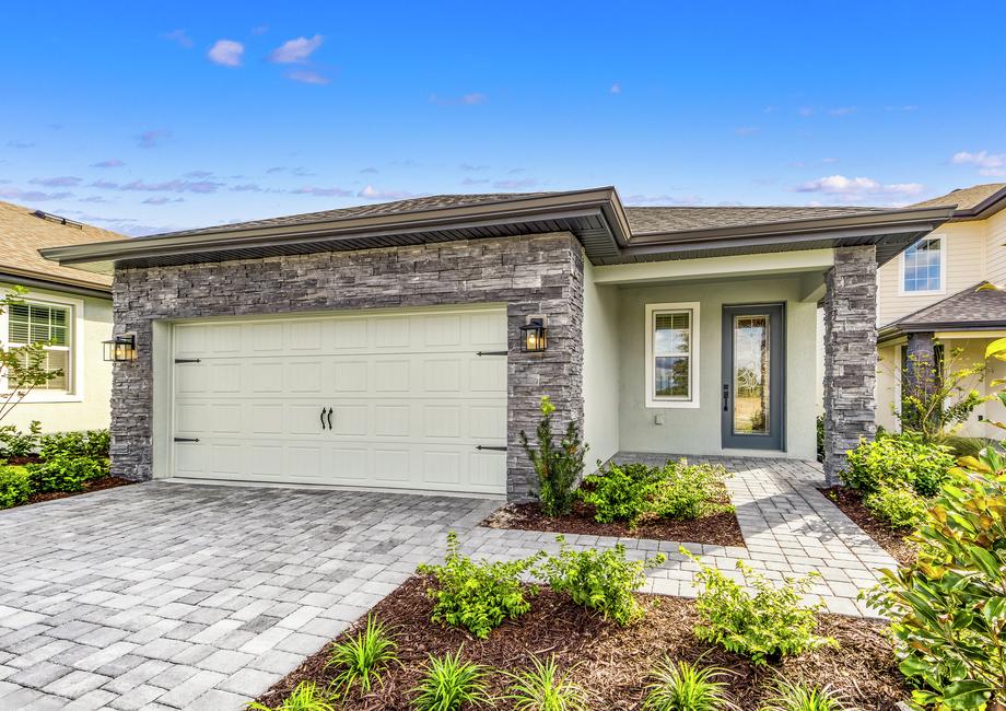 This home has a 2-car garage and gorgeous stone detailing.