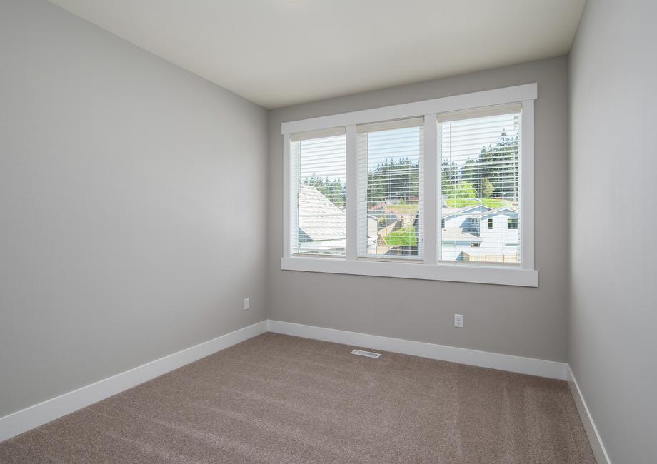 All of the secondary bedrooms are spacious and feature beautiful windows.