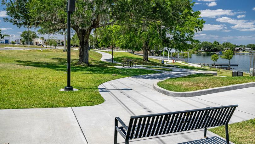 Bench overlooking walking trail in a park in Winter Haven, Florida