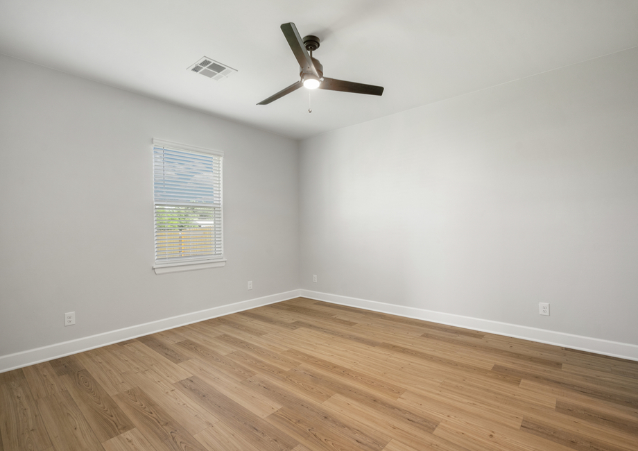 The master bedroom is large enough for king-sized furniture and has a wonderful window.