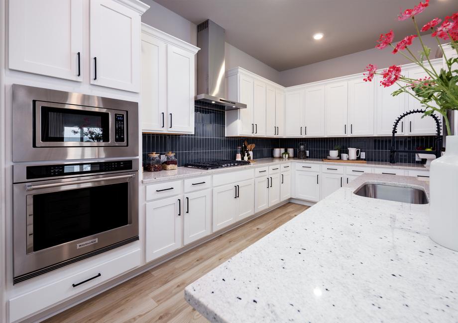 Enjoy the gorgeous granite countertops and modern tile backsplash.