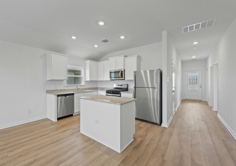 The foyer leads to the chef-ready kitchen