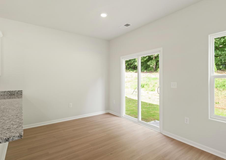 The dining room opens to the backyard