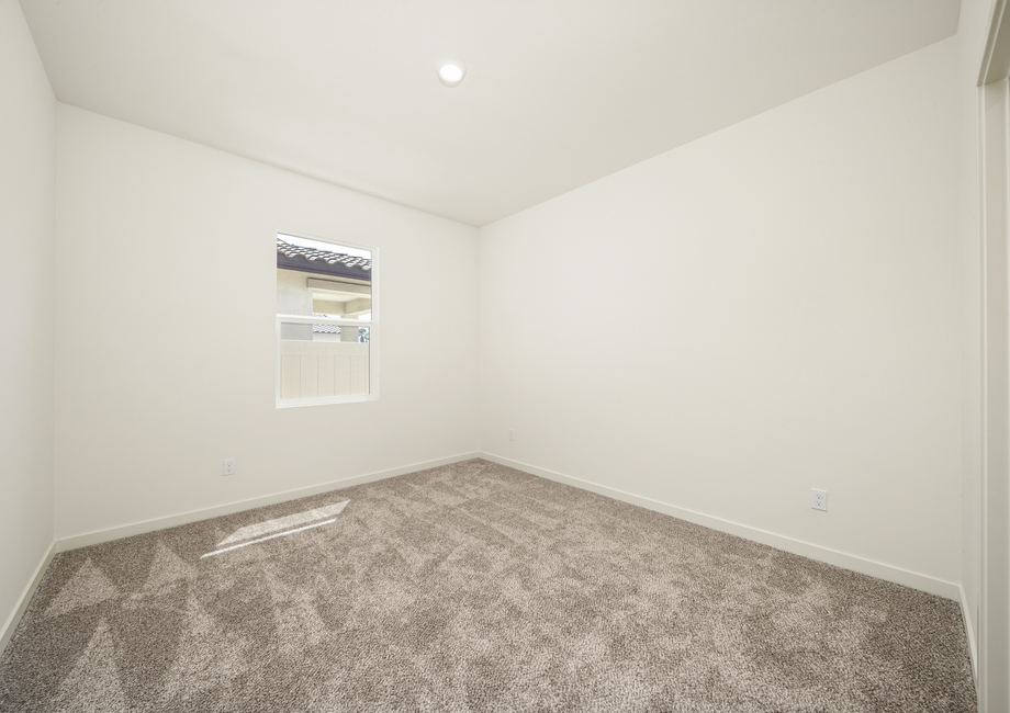 The secondary bedroom has carpet.