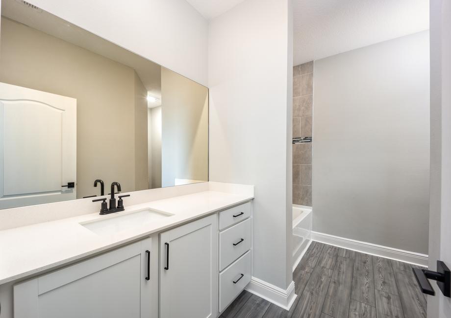 The master bathroom is filled with storage space
