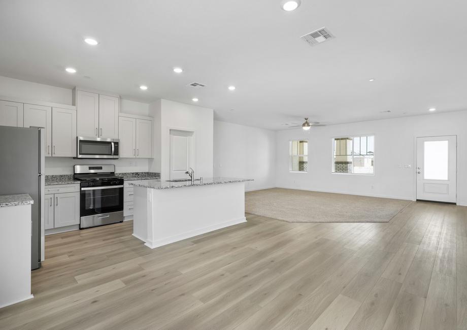 The kitchen is open to the family room and dining area.