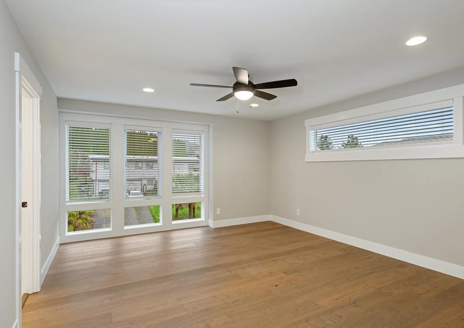 Stunning master bedroom has tons of natural light.