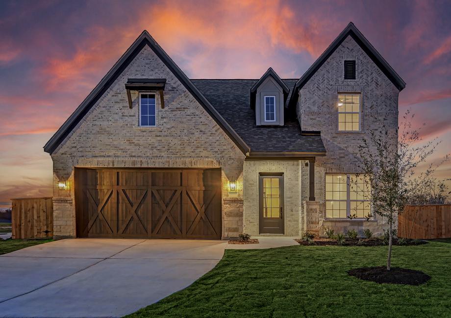Exterior of the Jordan at dusk, highlighting the stunning details of the home.