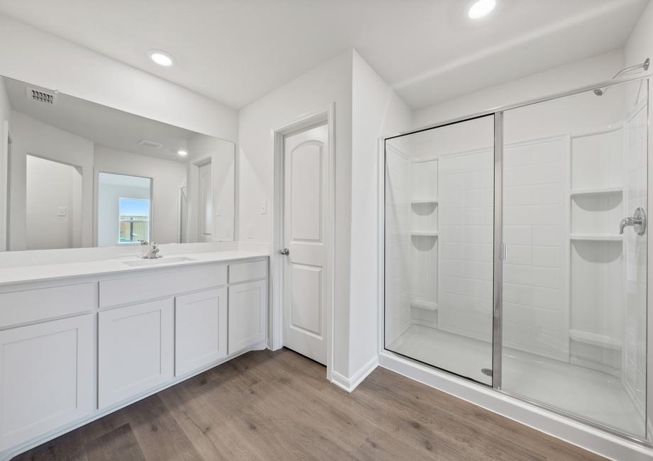 The master bathroom of the Reed  has a large vanity with plenty of counterspace.