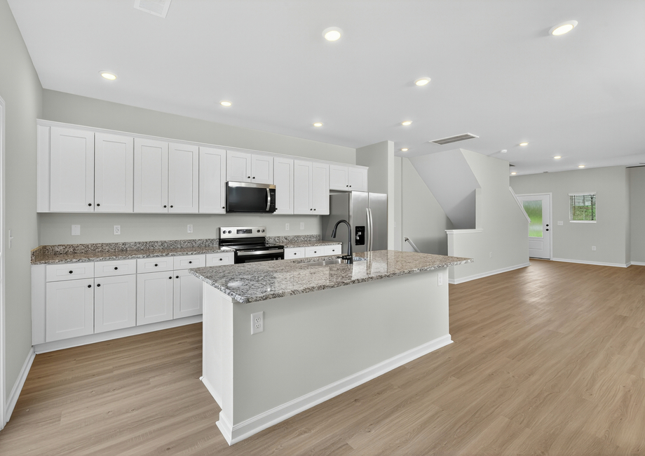 The kitchen comes with stainless-steel appliances. 