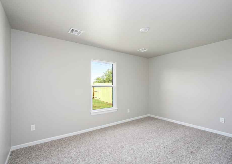 The master bedroom has a window that lets in wonderful natural light.