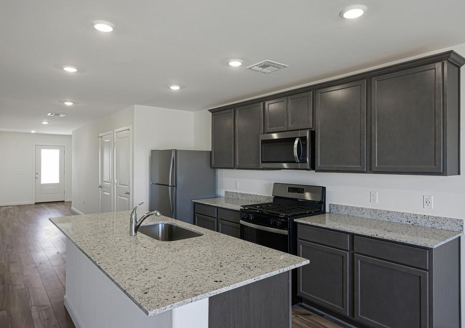 The kitchen comes with a full suite ofstainless steel appliances!