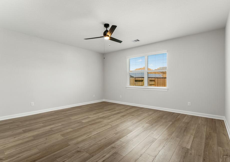 The spacious master bedroom with plenty of natural light