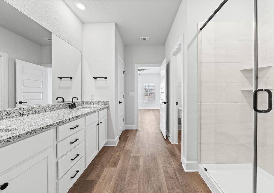 Another view of the master bath including the water closet and linen closet.