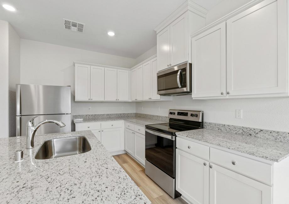 This kitchen has a beautiful granite island.