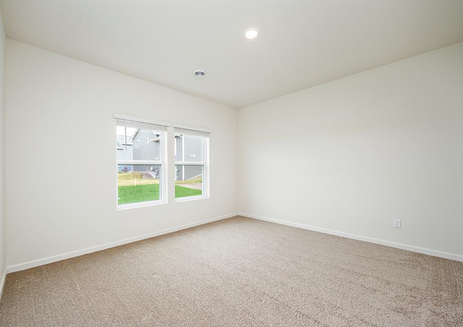 The master bedroom is spacious and has access to its own bathroom