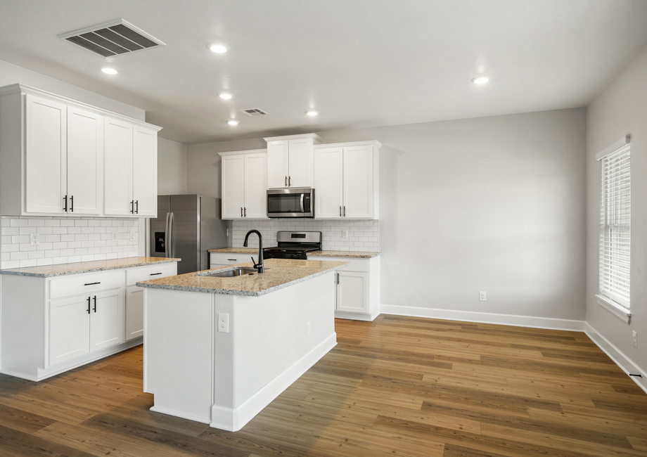 The dining dining room sits adjacent to the kitchen.