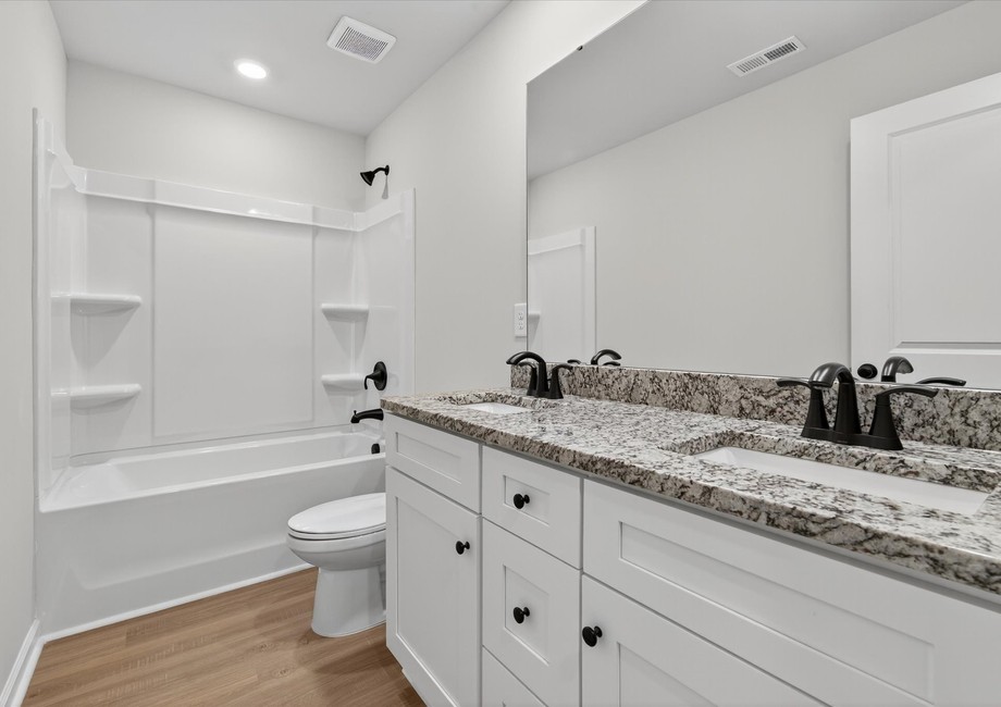 The master bathroom has dual vanities. 