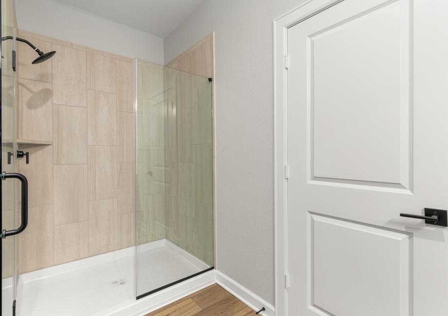 Step-in shower in the master bathroom with tile detail