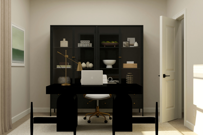 Home office with desk and bookshelf.